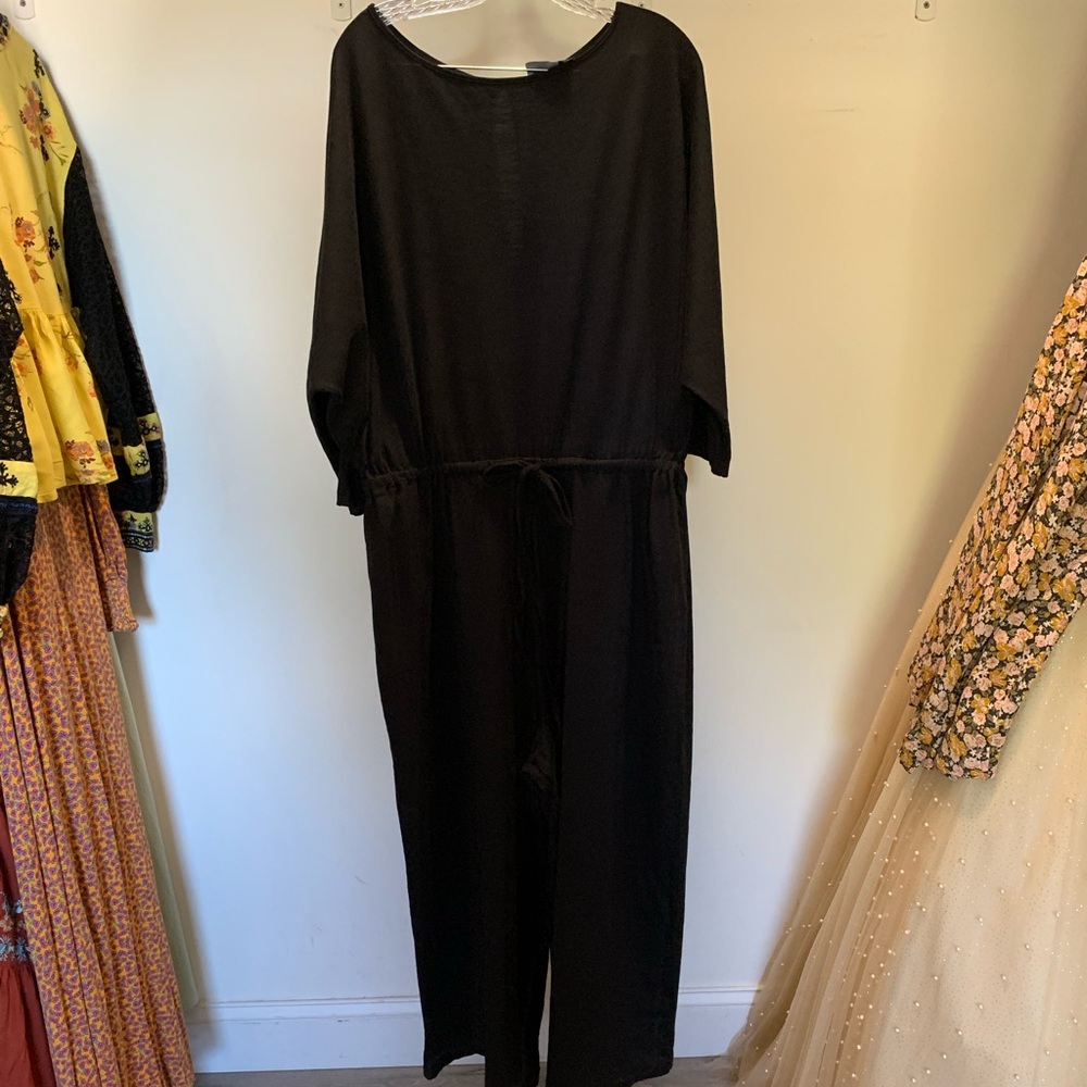 ASOS Black long sleeved jumpsuit with wide legged cropped pants and a ti…